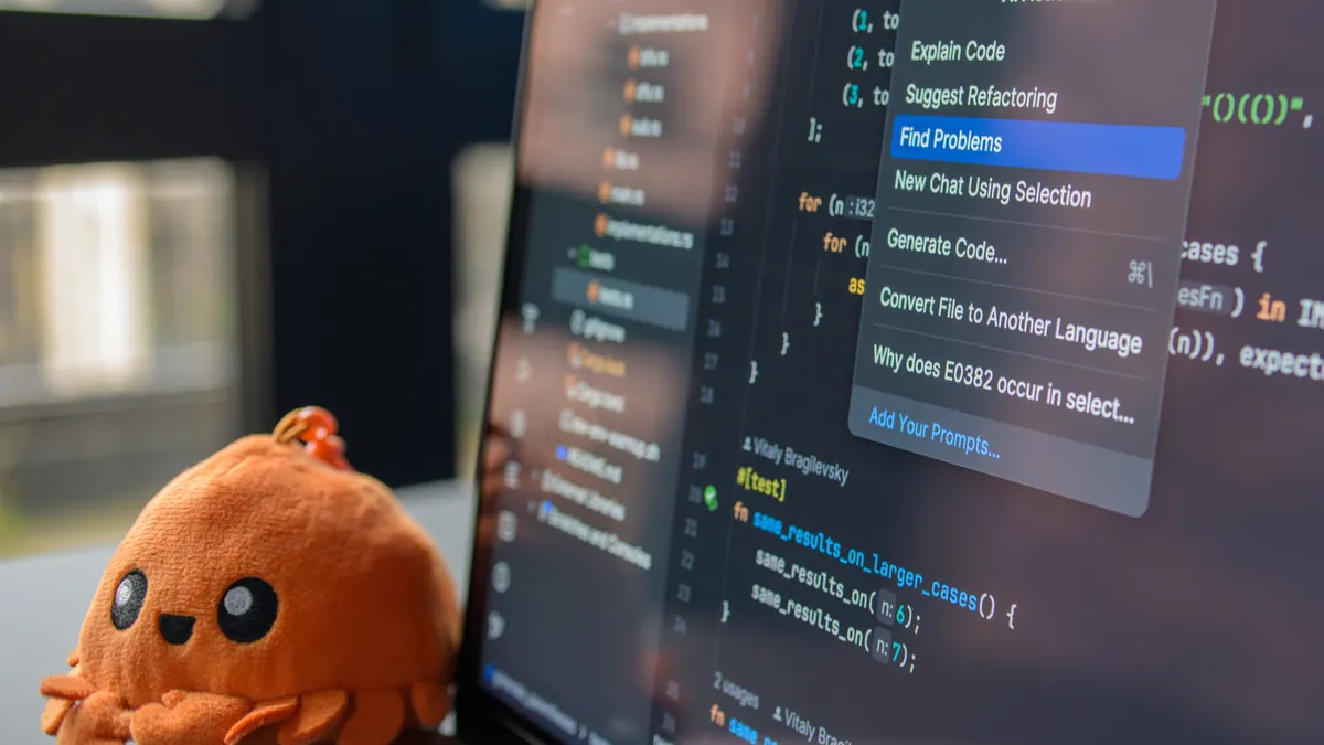 AI content editor vs AI writer: what solo bloggers actually need — Laptop with Code Editor and Plush Crab Toy