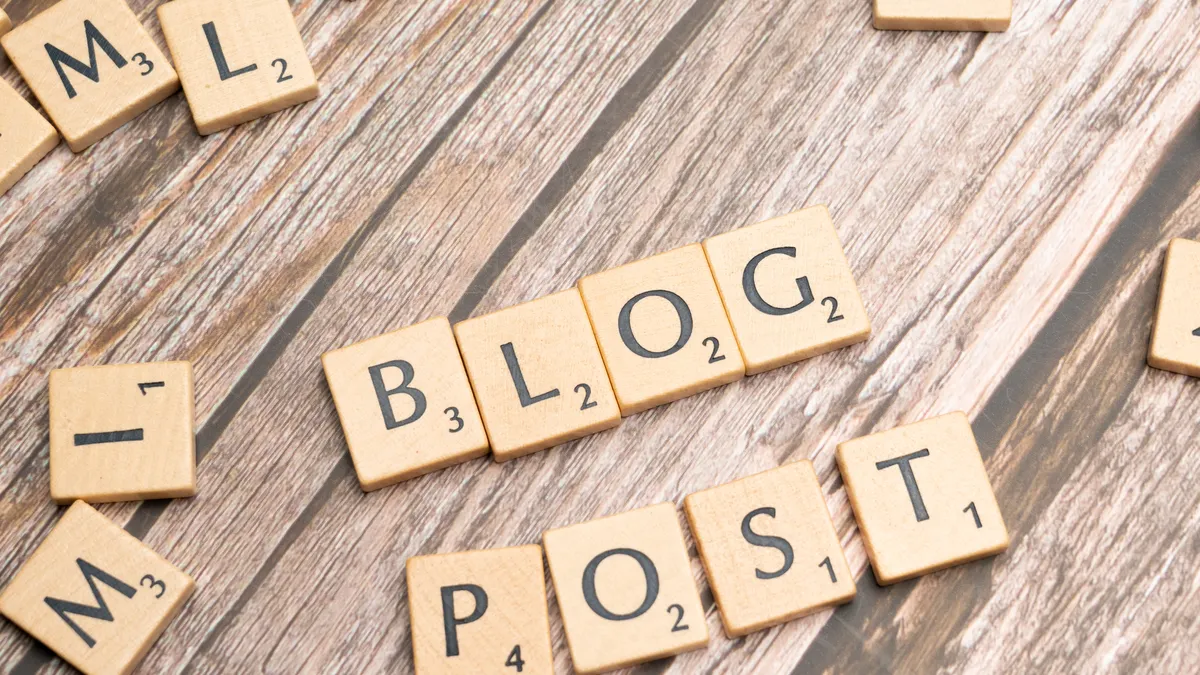 AI writer for long-form blog posts: which tools handle 2,000+ words well — Blog post with scrabble letters spelling out 