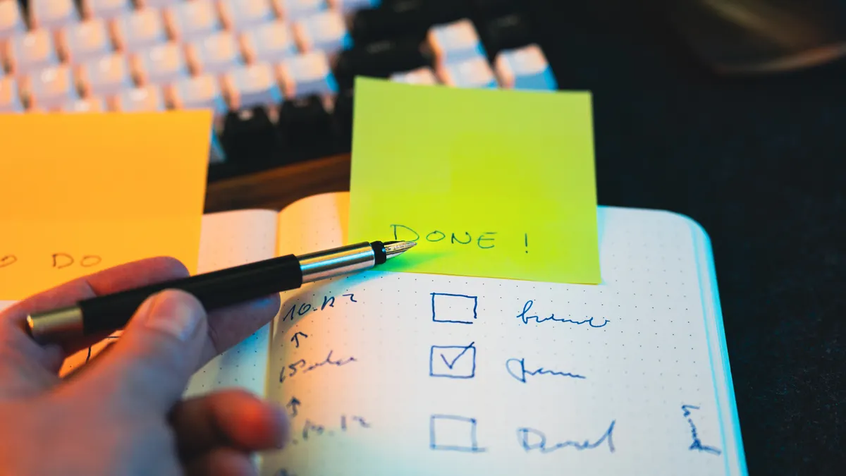 Choosing & Comparing AI Writing Tools — The Complete Guide — Hand Writing in Notebook with Checklist and Sticky Note